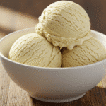 Homemade 3-ingredient vanilla ice cream scoops in white bowl